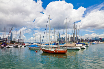 Fototapeta premium Idyllic view of sailing boats in the harbor of Victoria bay in Hong Kong.