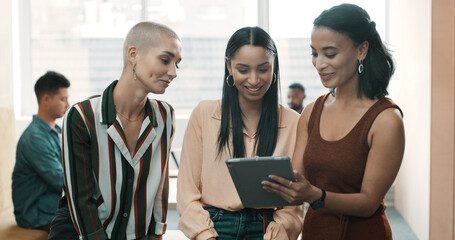 Team, creative and women with tablet at office for social media marketing, ad campaign or planning. Employees, discussion and collaboration with online engagement for brand awareness in meeting