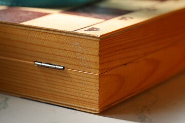 A close-up shot of a wooden box sitting on a table
