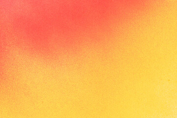 赤色と黄色のスプレー塗料で塗った背景	