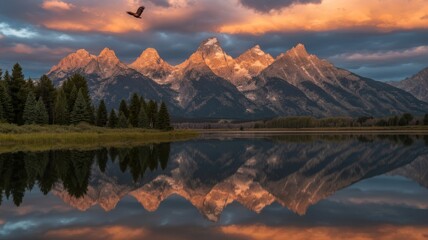 Fototapeta premium Majestic mountains mirroring in a serene lake at sunset, with an eagle soaring above, creating a breathtaking landscape that captures the harmony of nature and the freedom of wildlife