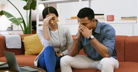 Sofa, business people and stress with laptop for debt, company bankruptcy or mistake. Man, woman or...