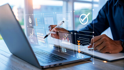 Focused analyst reviewing digital dashboard analytics on laptop, planning business growth with interactive data visualizations.