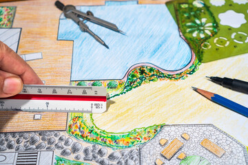 Garden design courses student is learning garden plan design by hand drawing.