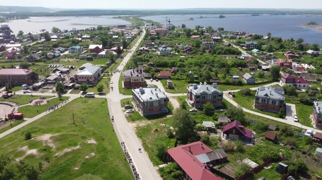 Drone shot of Sviyazhsk island town with red-roofed buildings near the Volga River