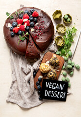 Home made vegan chocolate cake, with cacao and blueberries, healthy dessert recipe, healthy cacao cake with berries.
