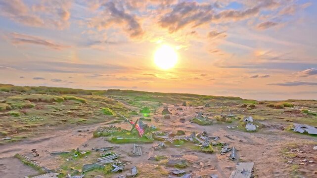 Drone footage of a B29 aircraft crash site showing the US flags in a sunset background, now serving as a US memorial. Located on Devils Dike Trail, Glossop, Peak District, UK