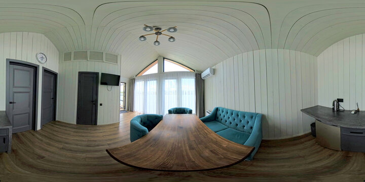 360 HDRI image of a modern living room with blue armchairs, wooden table, and light panel walls. Perfect for interior renderings, virtual tours, or real estate visualizations.