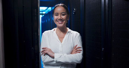 Woman, arms crossed and smile in server room for portrait, confident or career at IT company....