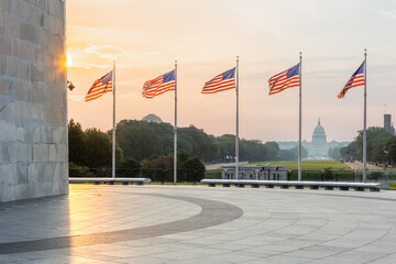 American flags at sunrise with U.S. Capitol in Washington DC © Thomas