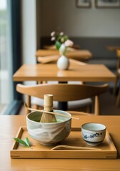 Chic matcha bowl on bamboo tray, clean Japanese-inspired caf&eacute; setting, soft lighting, realistic, depth of field, cinematic style