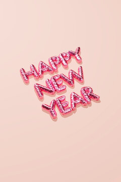 Pink happy new year balloon greeting on pastel background