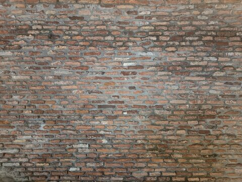 Red brick wall. Texture of old dark brown and red brick wall panoramic backgorund.Old red brick wall background, wide panorama of masonry.red brick wall texture grunge background.