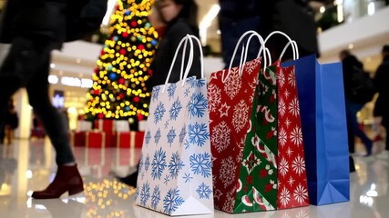Holiday shopping rush in busy mall with festive decorations and shoppers