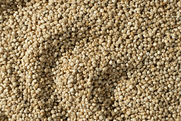 Uncooked White Quinoa Macro Top View. Natural Grain Background
