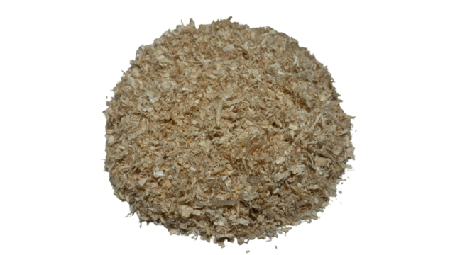 Heap of light beige wood shavings creating a textured surface pattern