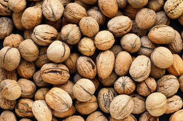 Top view of whole walnuts as background texture