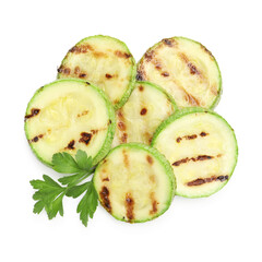 Delicious grilled courgette slices with parsley isolated on white, top view
