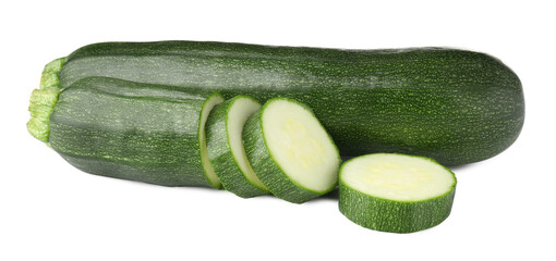 Whole and cut fresh zucchinis isolated on white