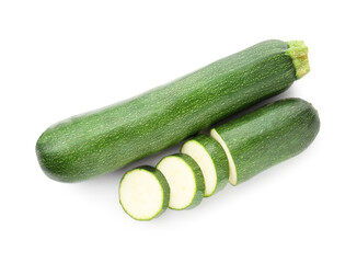 Whole and cut fresh zucchinis isolated on white, top view