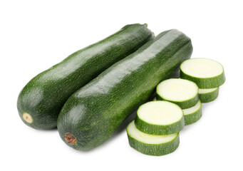 Whole and cut fresh zucchinis isolated on white