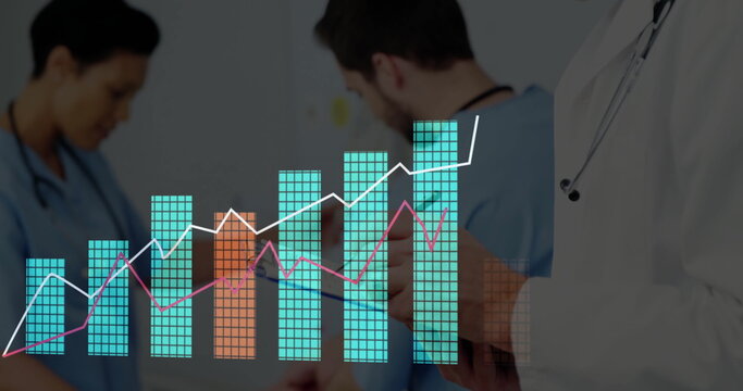 Reviewing data bars and line graphs, team holding tablet and wearing scrubs in clinic - Powered by Adobe
