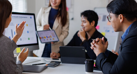 Business asian people, meeting and paper with charts for sales planning, portfolio and company report, digital marketing and team with tech in discussion for brainstorming, idea or plan of growth  © David