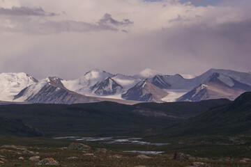 Fototapeta premium a mountain range covered with snow and glaciers. Mountain panorama