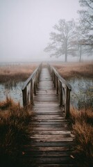 Misty wooden bridge stretches into fog