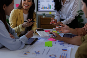 Fototapeta premium Asian Business financial Team, accountant discussing with partner are meeting to audit finance planning sales to meet targets set in next year. stock market concept.. 
