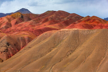 A mountain range with a red and yellow color