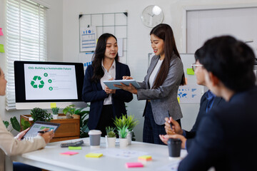 Team of asian business ESG environmental social governance policy for modish business to set a standard to achieve high ESG score
