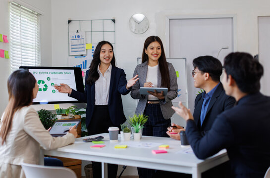 Team of asian business ESG environmental social governance policy for modish business to set a standard to achieve high ESG score
