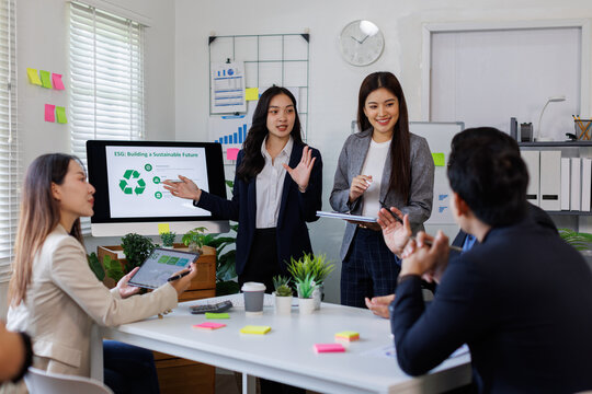 Team of asian business ESG environmental social governance policy for modish business to set a standard to achieve high ESG score
