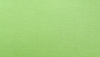 Fototapeta premium A light, vibrant lime green surface displays a subtle textured pattern.