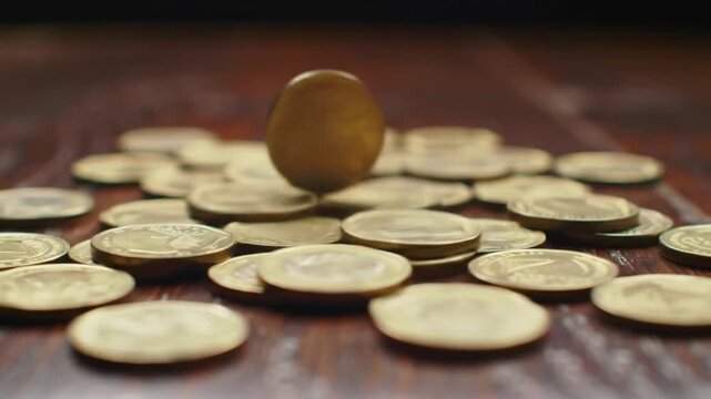 Concept of financial growth represented by a single golden egg rising above a pile of scattered coins, suggesting wealth accumulation and prosperity