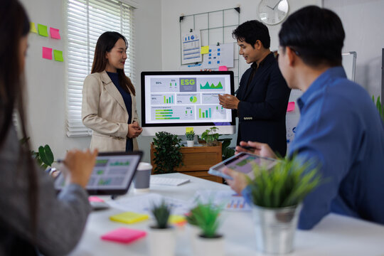diversity asian team discussion focused and talk ESG strategies risk,environment,social,governance for net zero goals in a sustainable green office