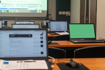 Empty Classroom with Computers and Green Screen