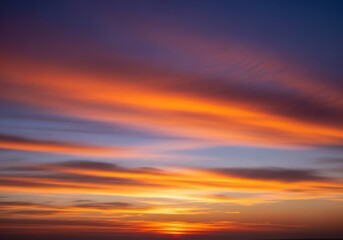 Obraz premium A breathtaking sunset paints the sky with vibrant hues of orange and purple, creating a serene and picturesque landscape