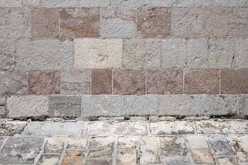 Old gray stone wall and flooring, an empty abstract interior, background photo