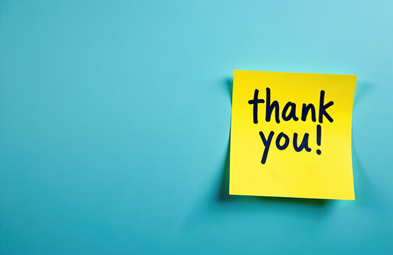 Yellow sticky note with handwritten text thank. on bright blue background. Simple, clean design offers ample copy space for business personal messages. Ideal for expressing gratitude in marketing,