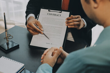 Lawyer explained to the client about the law that must be brought against the court case.