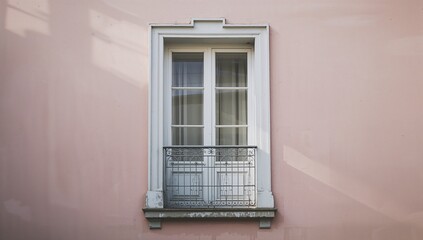 Fototapeta premium White Window with Balcony on Pink Wall