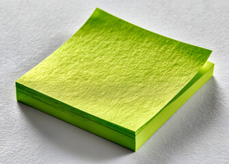 Light green sticky note wih tape isolated on white bckground