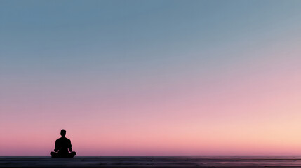 silhouette of a man sitting on the beach