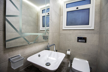 Interior design of a luxury show home bathroom with toilet and sink