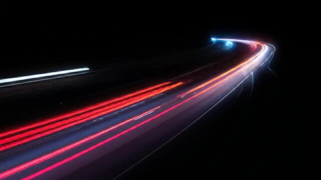 Night highway lights streaking in a curve