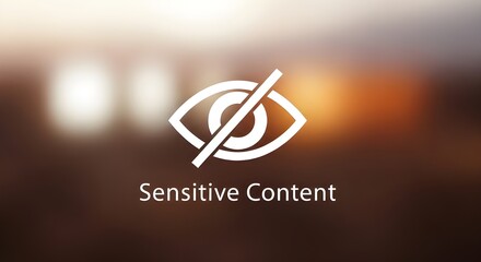 White 'Sensitive Content' Warning Text with Minimalist Eye Icon on Blurred Background