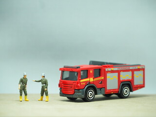 Mini toy of action figure at table with blurred background. Miniature photography concept design....