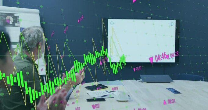 Business colleagues clapping as financial candlestick chart reversing decline into upward trend